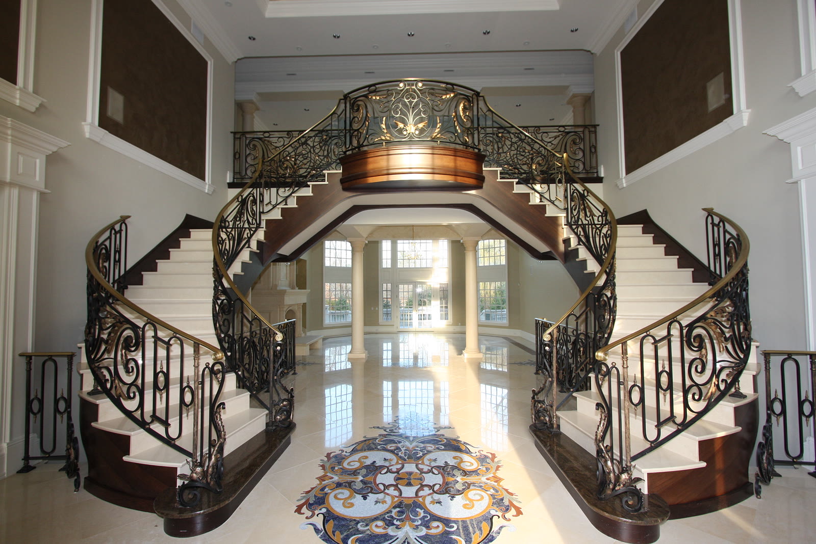 Grand luxury home foyer with staircase